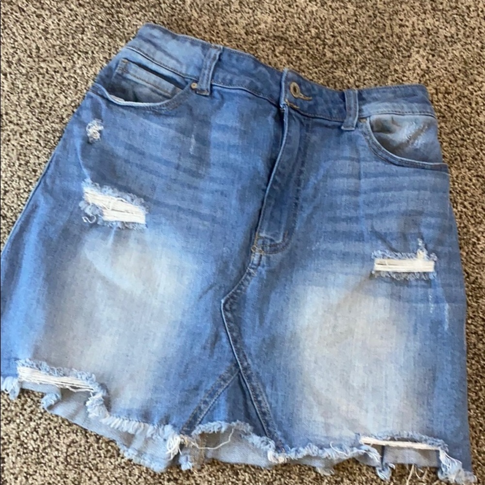 Medium washed distressed jean skirt.